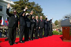 The NATO Secretary General, the U.S. President, and the Prime Ministers of Latvia, Slovenia, Lithuania, Slovakia, Romania, Bulgaria, and Estonia after a ceremony welcoming them into NATO on 29 March 2004.