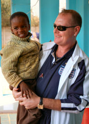 Gazza and child at SOS Children's Village Tlokweng (Mark Hooper, The FA)