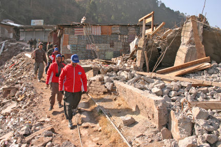SOS workers by Earthquake rubble