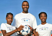 Lucas Radebe with SOS children, South Africa