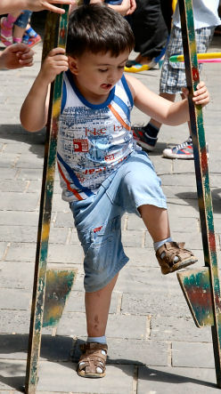 sponsored boy tries stilts