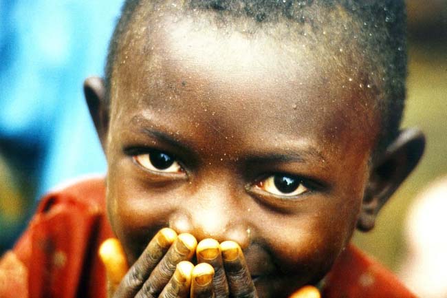 sudanese boy smiling in adversity