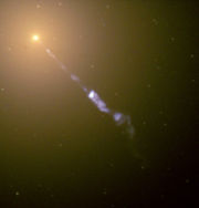 The jet originating from the center of M87 in this image comes from an active galactic nucleus that may contain a supermassive black hole. Credit: Hubble Space Telescope/NASA/ESA.