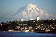 Northwest side of Mount Rainier seen from Tacoma. Liberty Cap is the visible summit from this view, sitting atop the Mowich Face.