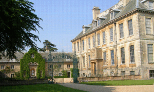 The west facade.  Many of the windows are false (see plan below), and are so placed as to provide symmetry.  The Baroque wrought-iron gate screen (possibly by John Warren) closes a courtyard between house and stables, thus creating the effect of a cour d'honneur to the house's west entrance (C on plan below).