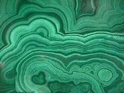 A polished slice of Malachite