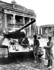 T-34-85 equipped with stand-off screens to protect thinner side and top armour from the HEAT warheads of Panzerfausts during street fighting. These particular shields were constructed from 5–8 mm (0.2–0.3 in) steel wire. Berlin, May 1945.