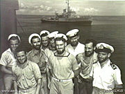 Australian sailors with a Bathurst class corvette in the background. The RAN commissioned 56 of this class of corvettes during World War II