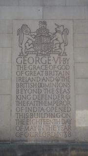 A plaque on Manchester Town Hall records George VI's titles before giving up the title Emperor of India.
