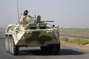 Ukrainian army soldiers aboard a BTR-80 in Iraq