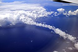 Clouds and cloud bow above Pacific