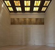 The words of the Gettysburg Address can be seen carved into the south wall of the interior of the Lincoln Memorial, designed by Henry Bacon and sculpted and painted by Daniel Chester French and Jules Guerin, respectively.