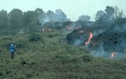 An ʻaʻā lava flow overruns vegetation during the 1984 eruption