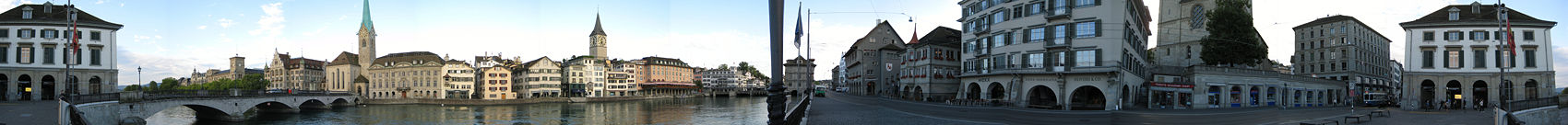 Along the river with several churches in the background