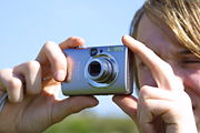 A handheld digital camera.