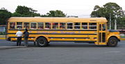 Buses like these are common in Managua. This is a former United States school bus, but is used as urban public transport.