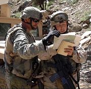 Soldiers in south-eastern Afghanistan check their coordinates during a combat patrol.